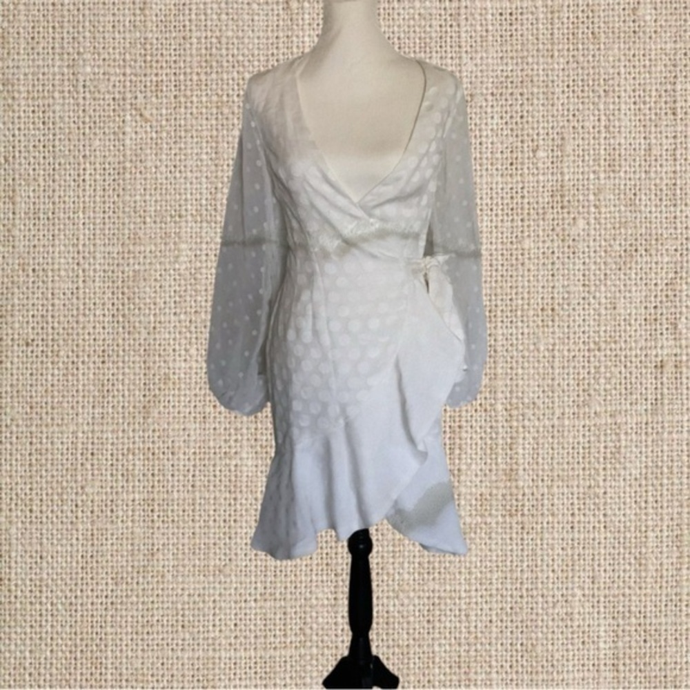 Cute wraparound white dress with a ruffle detailing